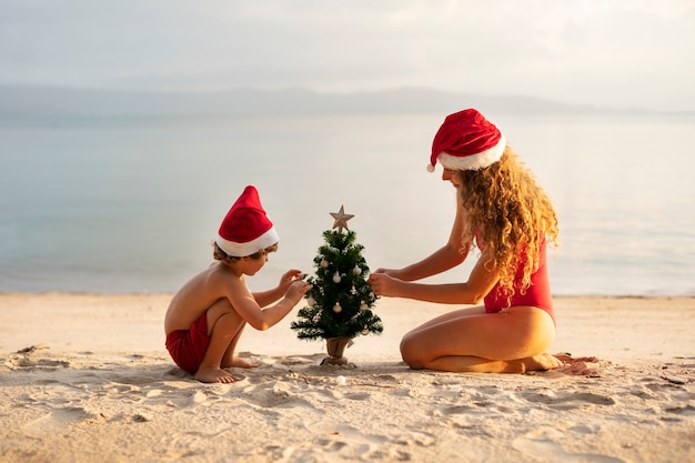 Mom and son celebrating christmas in july