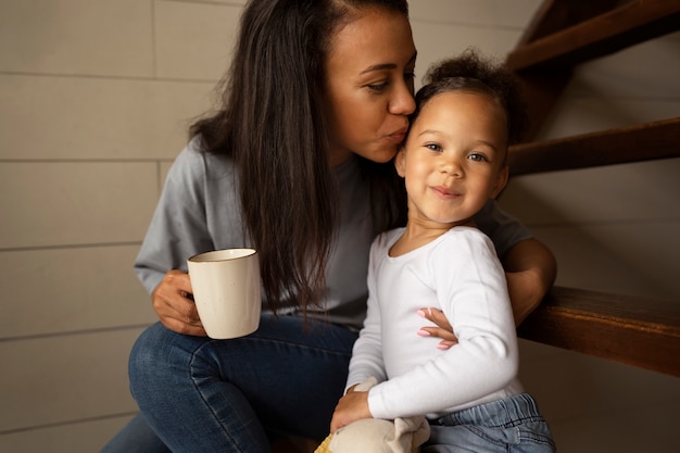 Free photo mom spending time with her black baby