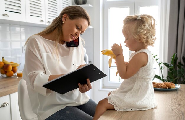 Mom working at home with child during quarantine