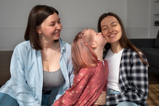 Free Photo mommies spending time together with their daughter at home