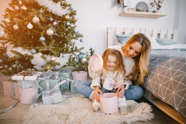 mommy and daughter opening gifts