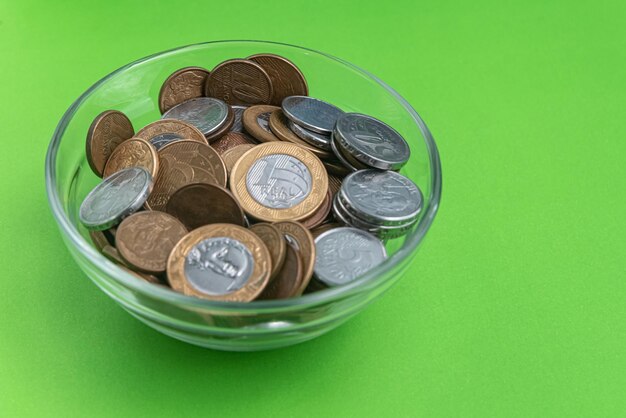 Free Photo money - brazilian coins - on glass bowl