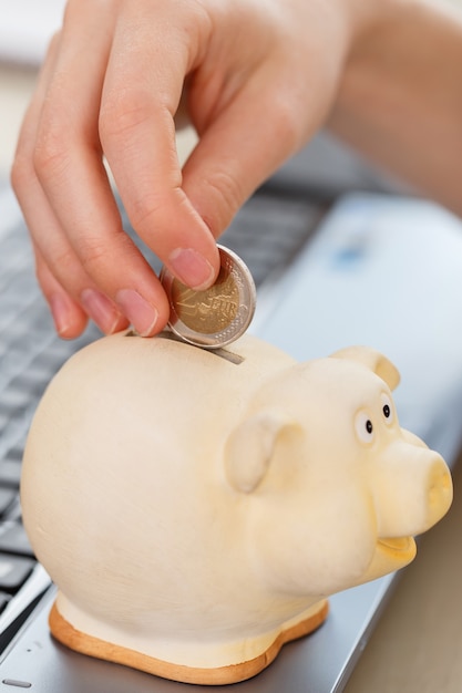 Money, finance. woman with piggy