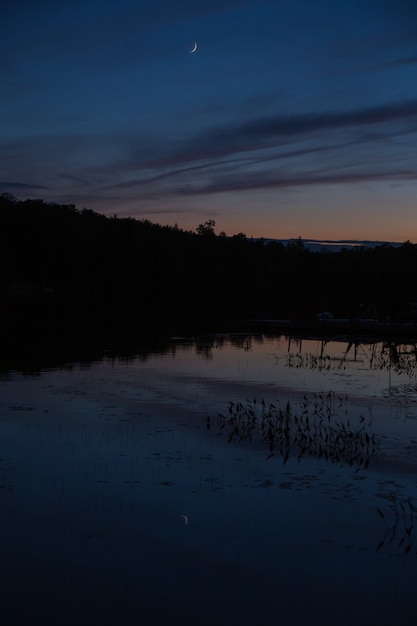 Free photo moon reflected on the lake