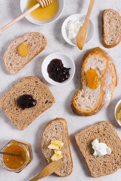 Morning breakfast with honey and jam on slices of bread