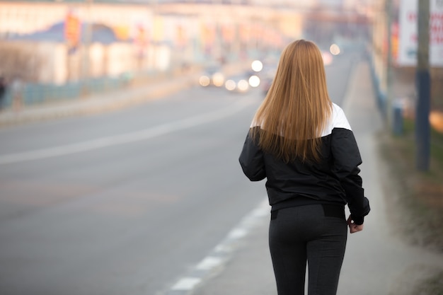 Morning jogging on the city bridge