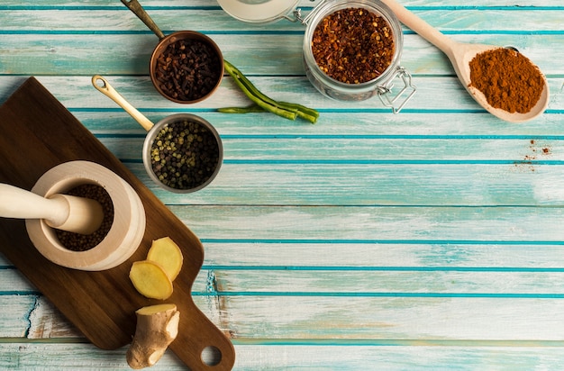 Free photo mortar and pestle near spices