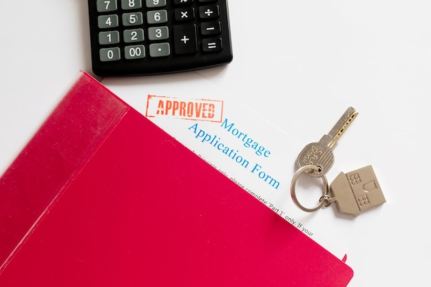 Free photo mortgage papers and key on table