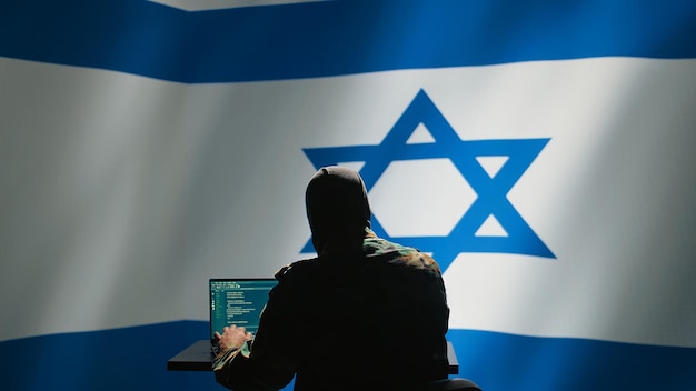 Free photo mossad israeli spy commits psyop sabotage using laptop