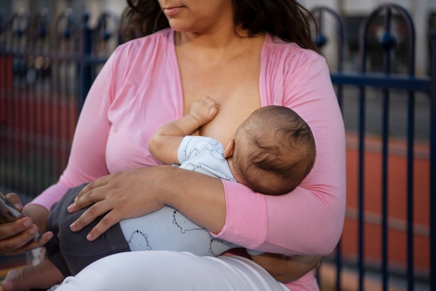 Mother breastfeeding side view