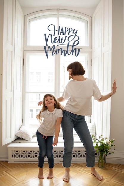 Free photo mother and child with happy new month lettering