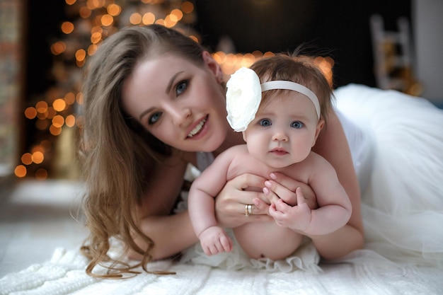 Free Photo mother and cute baby indoors