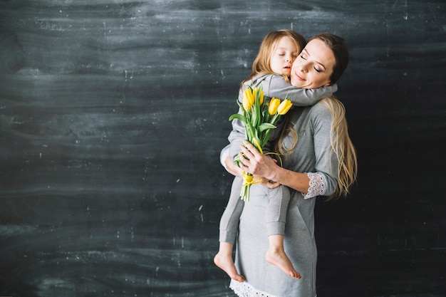 Free photo mother and daughter celebrating mothers day with hug