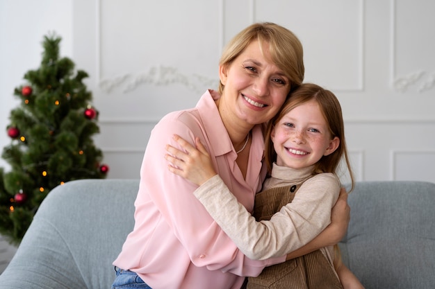 Free photo mother and daughter celebrating new years eve at home together