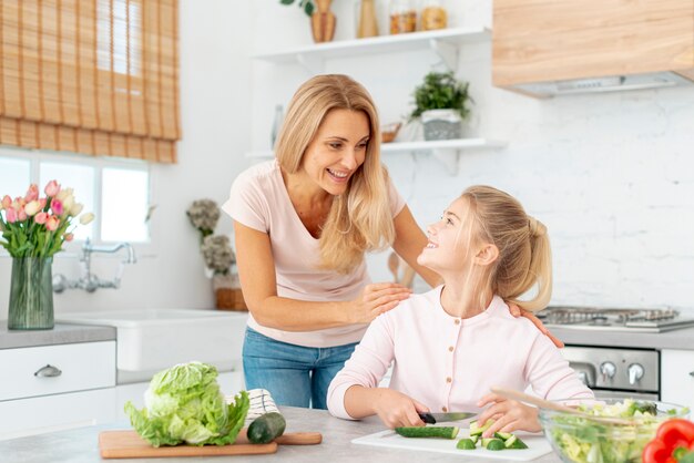 Mother and daughter cooking together