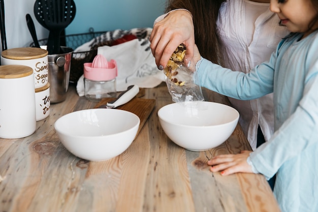 Mother and daughter having breakfast