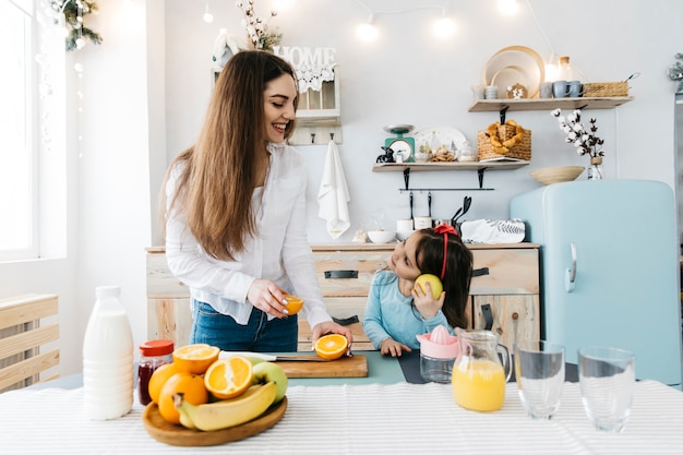 Mother and daughter having breakfast