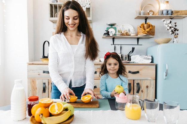 Mother and daughter having breakfast