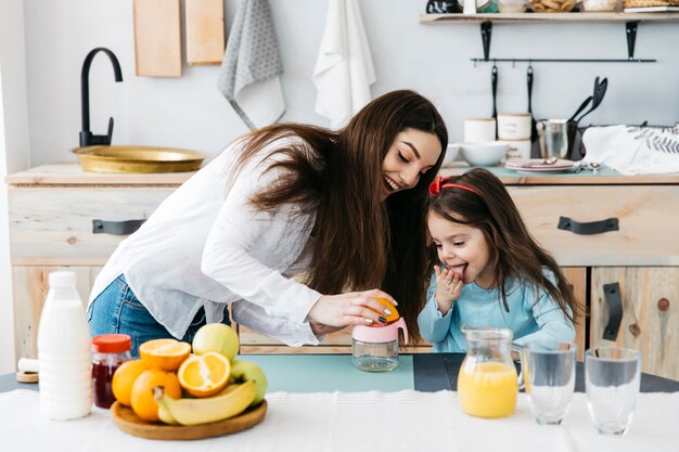 Mother and daughter having breakfast