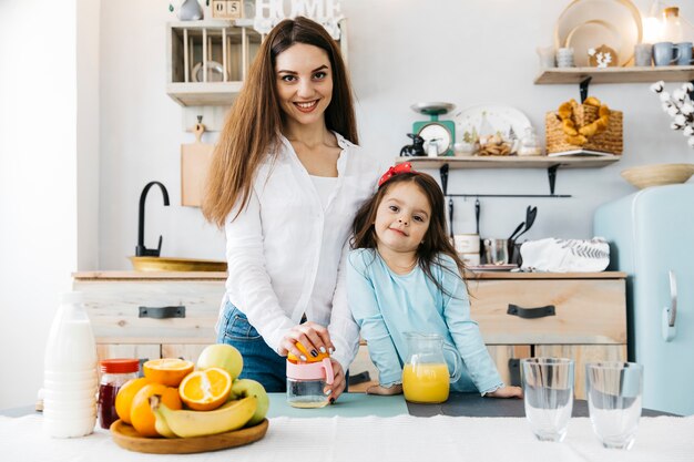 Mother and daughter having breakfast