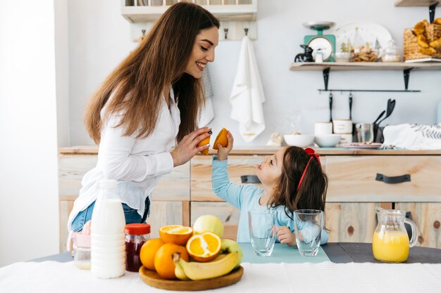 Mother and daughter having breakfast