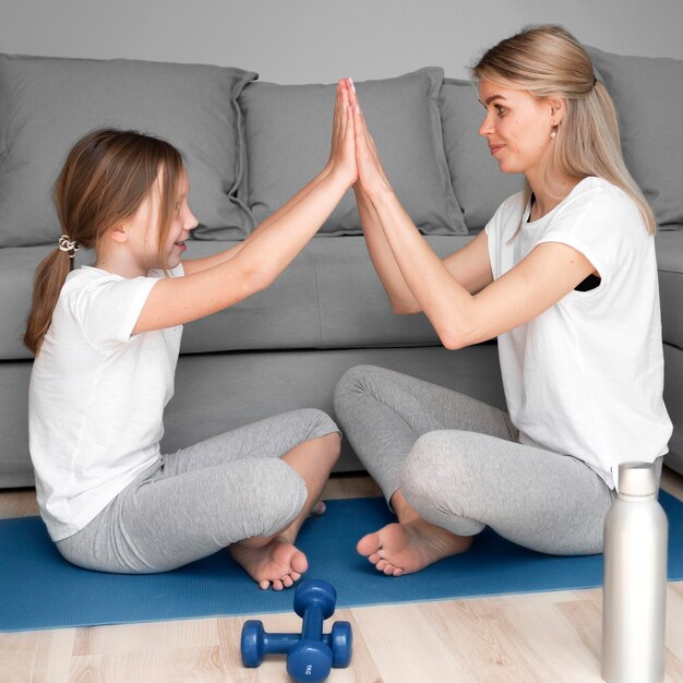 Mother and daughter high five