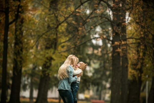 Mother and daughter laughing in the park