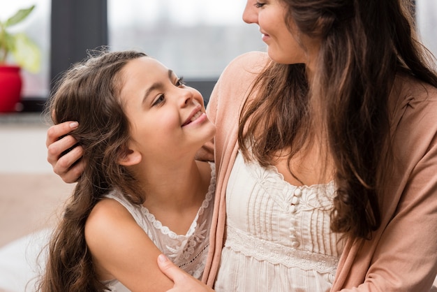 Mother and daughter looking at each other