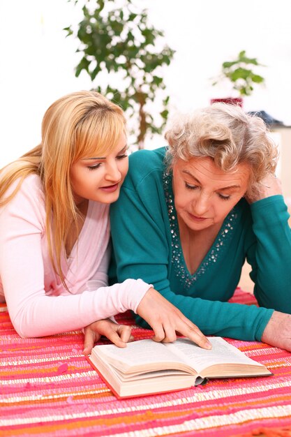 mother and daughter reading a book