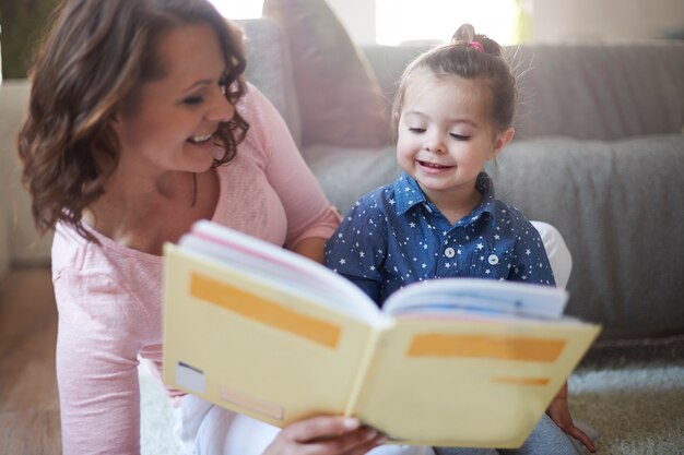 Mother and daughter reading a book