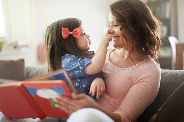 Mother and daughter reading a book