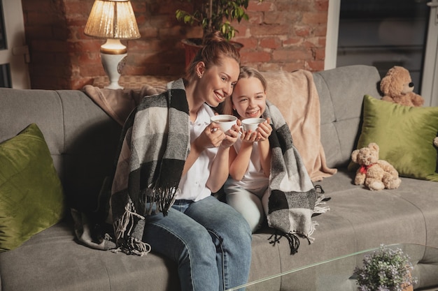 Mother and daughter during self-insulation at home while quarantined