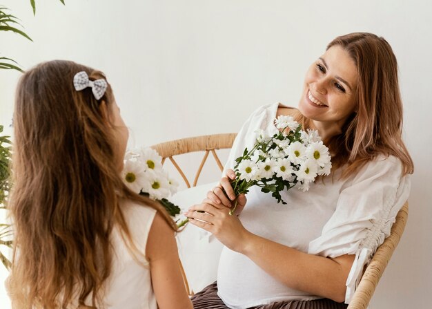 Mother and daughter with bouquet of spring flowers