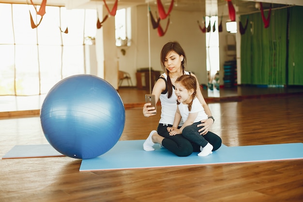 mother and daughter with fitball