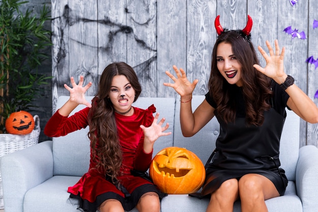 Free photo mother and daughter with halloween make-up