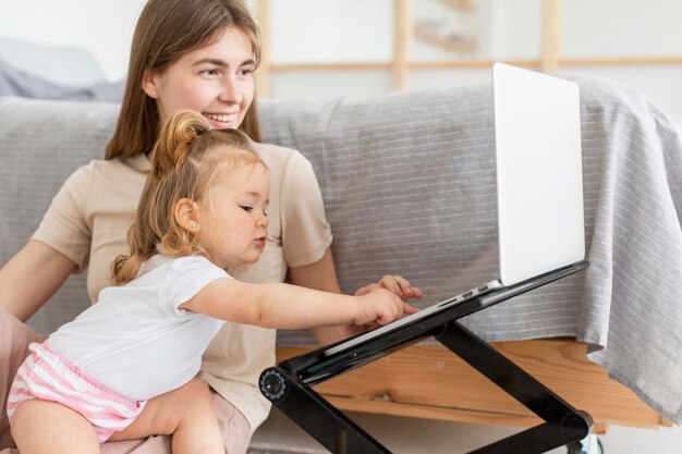 Mother and daughter with laptop