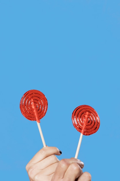 Mother and daughter with lollipops