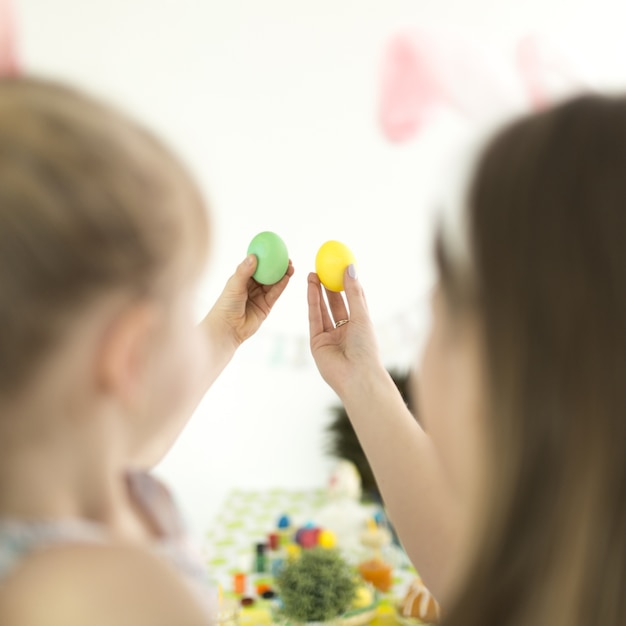 Mother and daughter with painted eggs