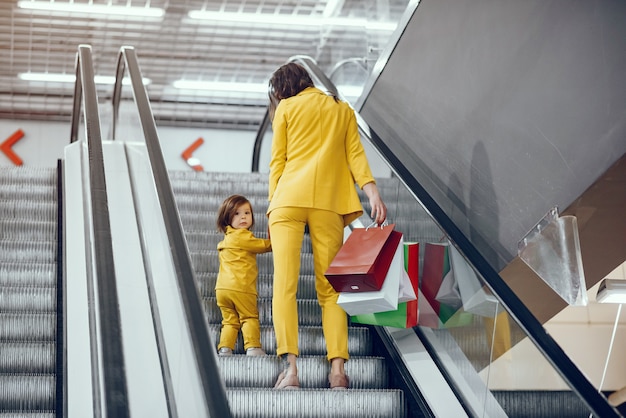 Mother and daughter with shopping bag 