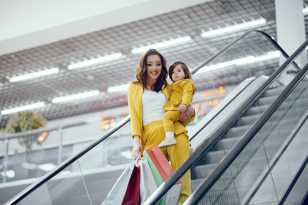 Mother and daughter with shopping bag 