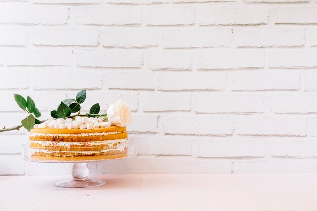 Mother day concept with cake in front of brick wall