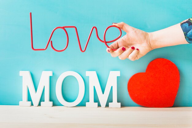 Mother day concept with heart and hand