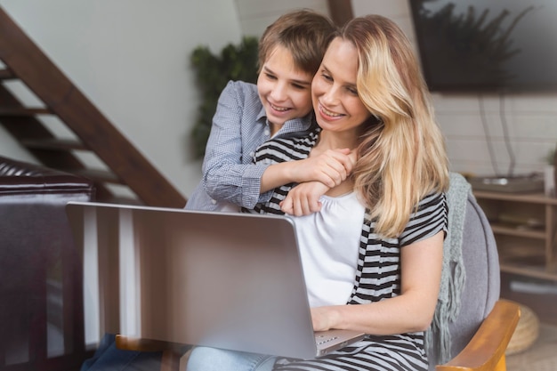 Mother happy to work from home with her son