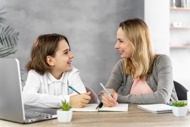 Mother helping daughter to study