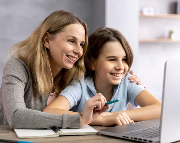 Mother helping daughter to study