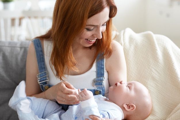 Mother and her child posing indoor