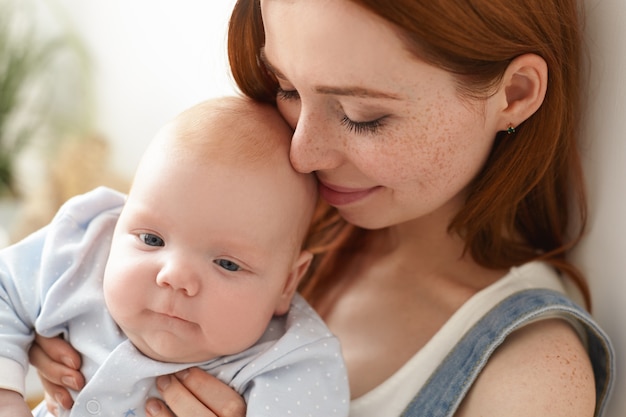 Mother and her child posing indoor