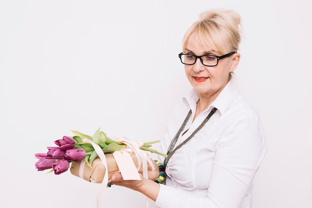 Mother holding purple roses