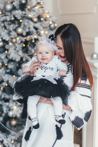 The mother holds on hands her daughter