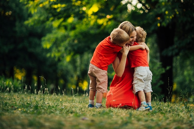 Mother hugging her children